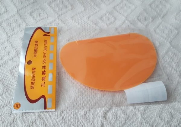 Rasqueta de plástico flexible de color naranja